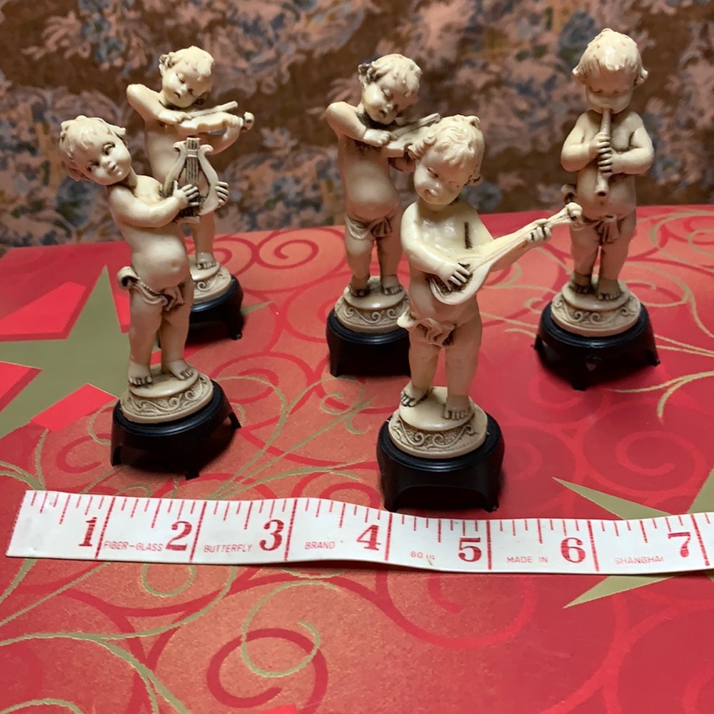 Five vintage Cherub babies playing instruments made in Italy.